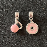 Dupla de Berloques Kettlebell + Anilha Rosa