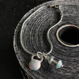 Pulseira Kettlebell Tie Dye com Barra Turquesa