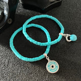 Dupla de Pulseiras Turquesa com Kettlebell e Anilha