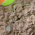 Pulseira Beach Tennis com bolinha dourada