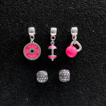 Trio de Berloques Cross Pink + Dupla de Espaçadores.