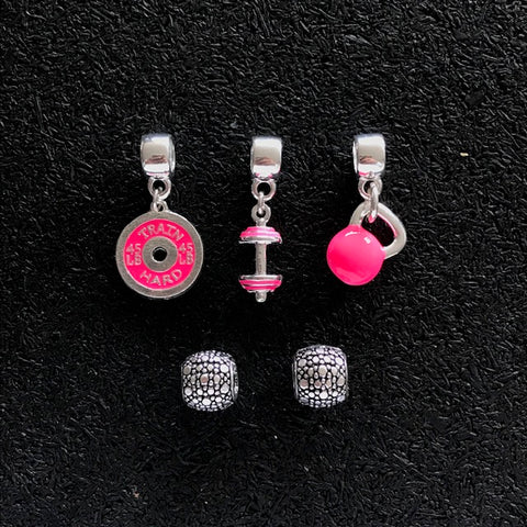 Trio de Berloques Cross Pink + Dupla de Espaçadores.