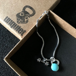 Pulseira Kettlebell Turquesa com barra